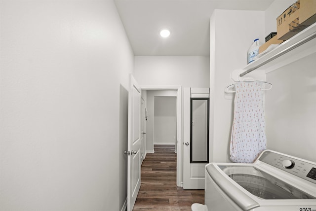 laundry area featuring dark wood-type flooring and washer / dryer