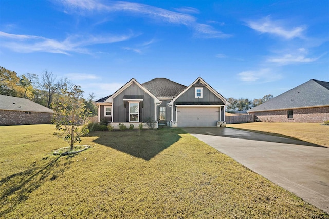 craftsman house with a front yard and a garage