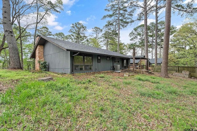 1638 E Tanglewood Dr, Hideaway, TX 75771 - back of house featuring central air condition unit and fence