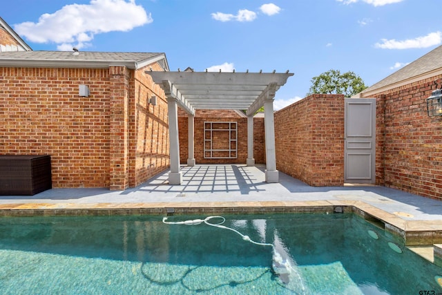 view of pool with a patio and a pergola