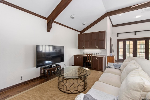 living room featuring french doors, crown molding, light wood-type flooring, and lofted ceiling with beams