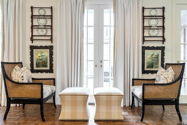 sitting room with parquet floors and french doors