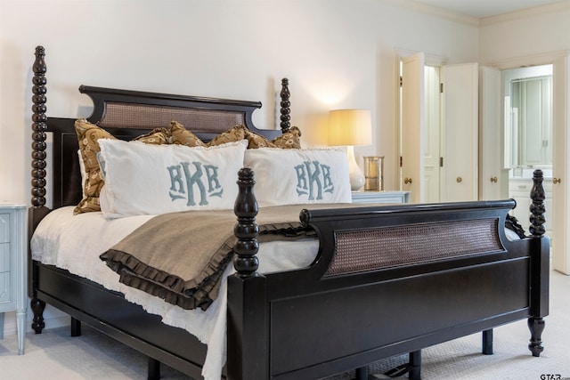 bedroom featuring ornamental molding and carpet floors