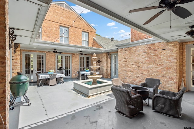 view of patio featuring french doors and ceiling fan