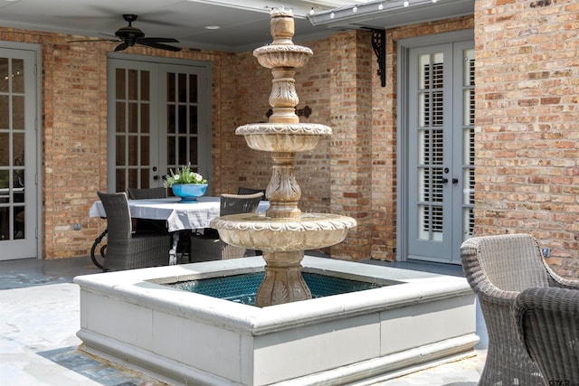 view of patio with french doors and ceiling fan