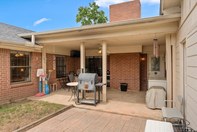 view of patio with a grill