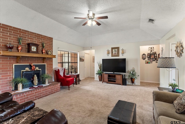 living area featuring carpet, a ceiling fan, a textured ceiling, visible vents, and baseboards