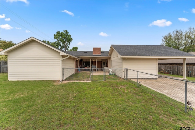 ranch-style house with a fenced backyard, a gate, and a front lawn