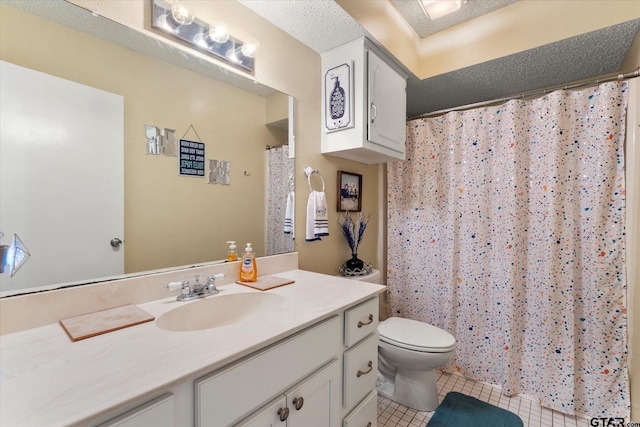 bathroom with toilet, tile patterned floors, vanity, and curtained shower
