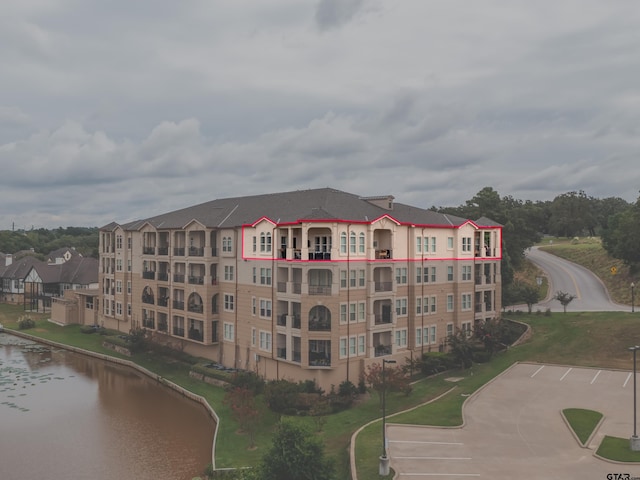 view of building exterior with a water view