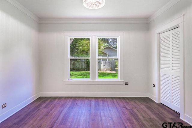 unfurnished room with crown molding and dark hardwood / wood-style floors