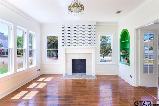 unfurnished sunroom with a high end fireplace