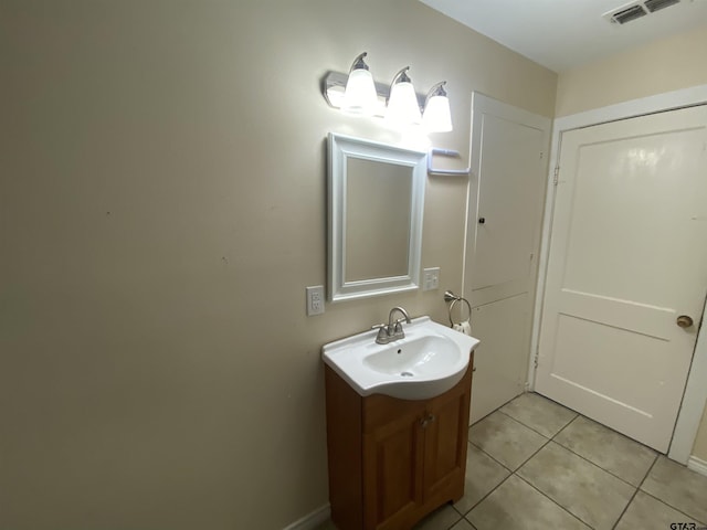 bathroom with visible vents, vanity, and tile patterned floors
