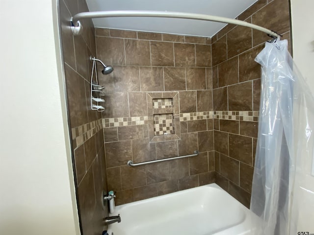 bathroom with shower / bath combo with shower curtain