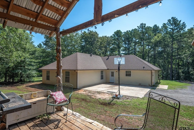 exterior space with a patio area and a lawn