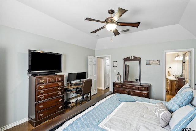 bedroom with ensuite bath, sink, ceiling fan, lofted ceiling, and dark hardwood / wood-style flooring