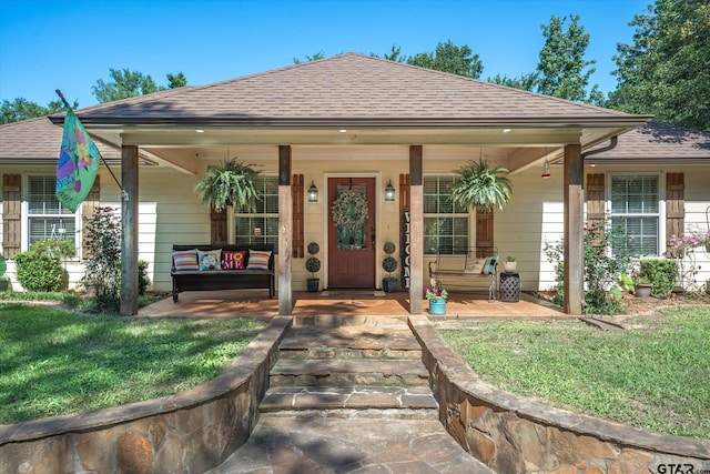 view of front of house with a front lawn and a porch