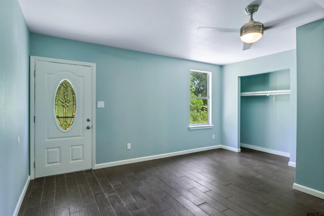 entryway with dark hardwood / wood-style flooring and ceiling fan