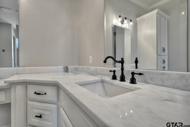 bathroom with vanity and crown molding