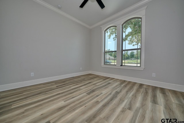 spare room featuring crown molding, ceiling fan, and light hardwood / wood-style floors