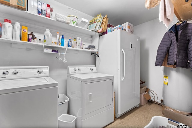 clothes washing area featuring independent washer and dryer