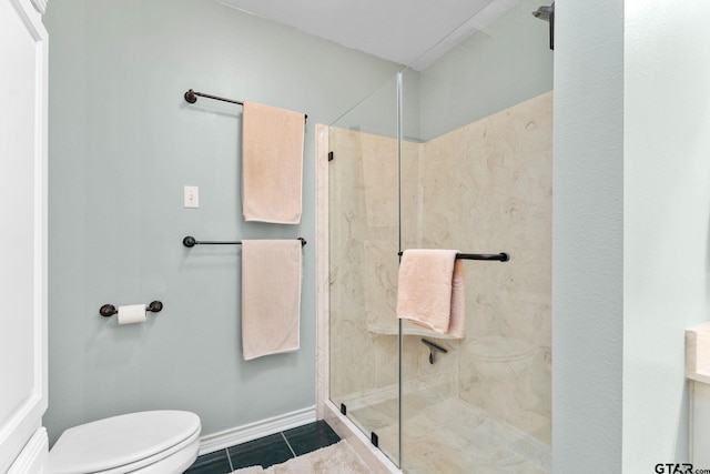 bathroom with walk in shower, tile patterned floors, and toilet