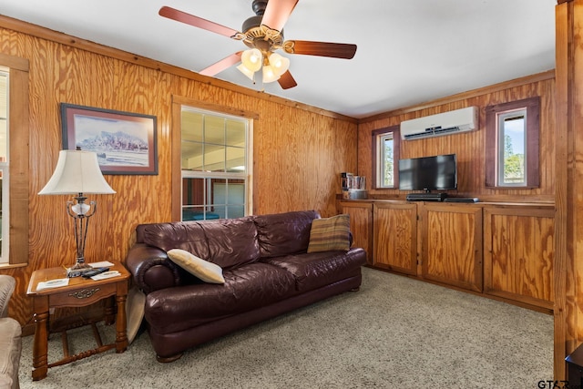 living room with light carpet, a wealth of natural light, an AC wall unit, and wood walls