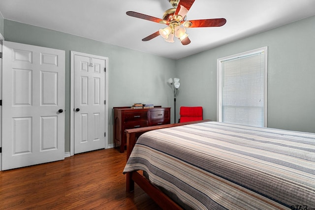 bedroom featuring dark hardwood / wood-style flooring and ceiling fan