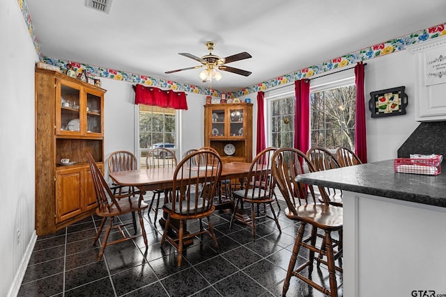 dining space featuring ceiling fan