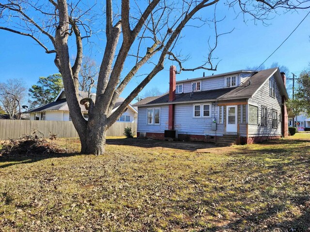 501 E Park Ave, Palestine, TX 75801 - rear view of house with entry steps, a chimney, crawl space, and central AC