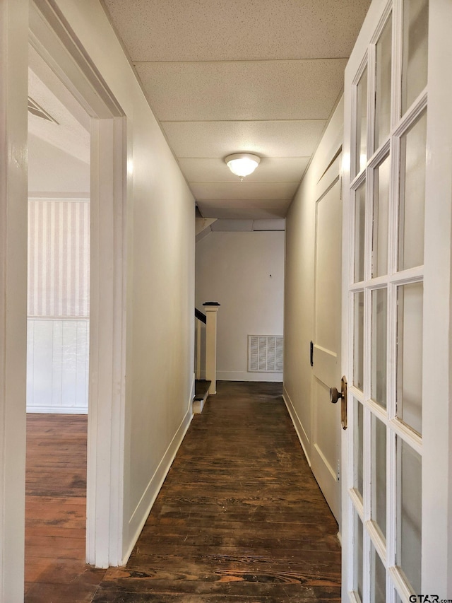 501 E Park Ave, Palestine, TX 75801 - hall with wood finished floors, french doors, a paneled ceiling, stairs, and baseboards