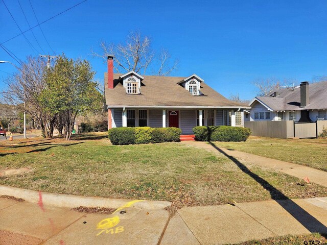 501 E Park Ave, Palestine, TX 75801 - cape cod house with covered porch and a chimney