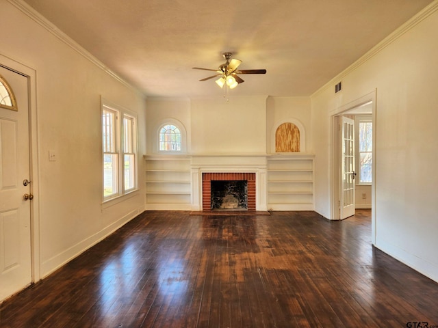 501 E Park Ave, Palestine, TX 75801 - unfurnished living room with a brick fireplace, a ceiling fan, dark wood finished floors, crown molding, and baseboards