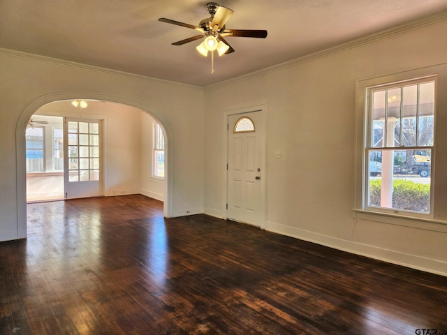 501 E Park Ave, Palestine, TX 75801 - entryway featuring arched walkways, dark wood-style floors, ornamental molding, ceiling fan, and baseboards