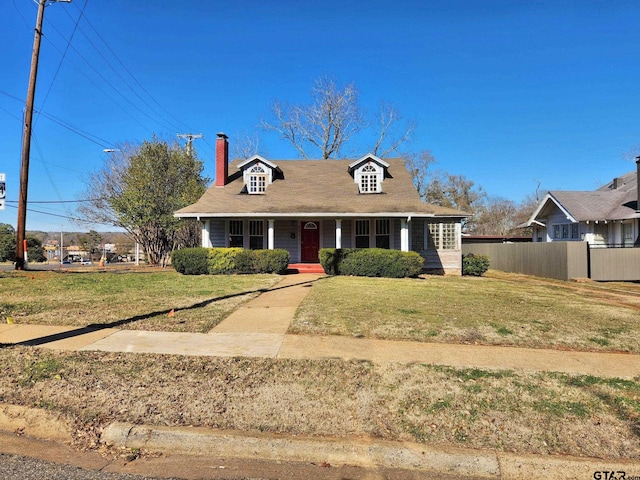 view of front of home featuring a porch and a front yard