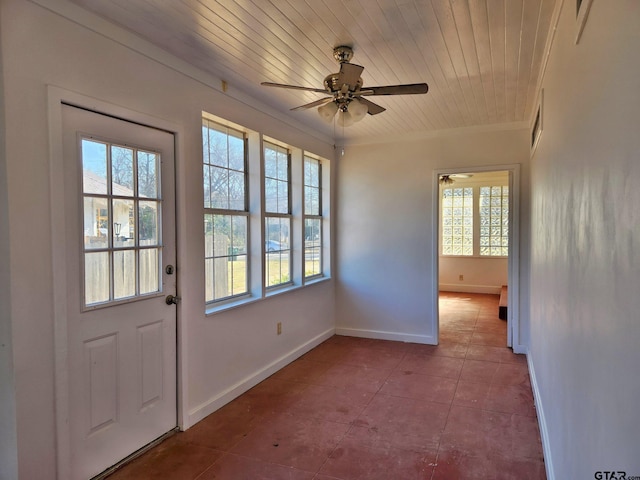 doorway to outside with light tile patterned flooring, ceiling fan, wood ceiling, and ornamental molding