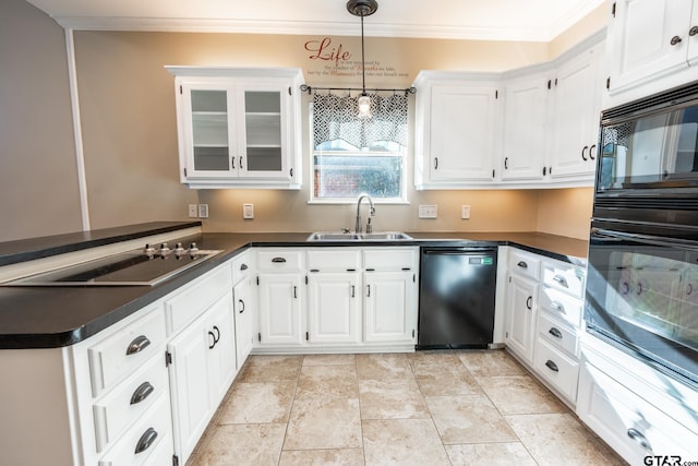 kitchen with white cabinets, sink, hanging light fixtures, and black appliances