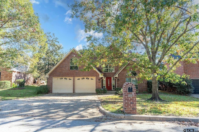 view of front facade featuring a front lawn and a garage