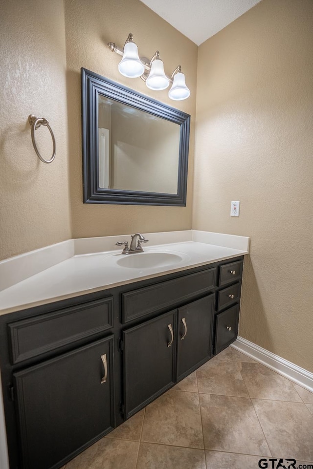 bathroom featuring tile patterned flooring and vanity