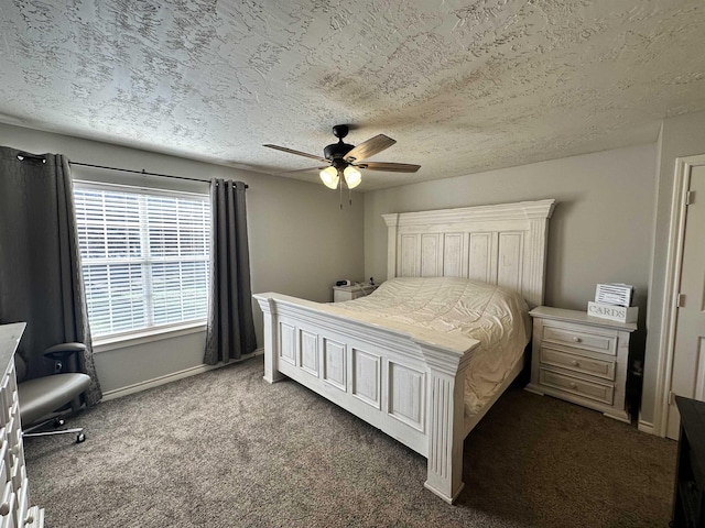 carpeted bedroom featuring ceiling fan and a textured ceiling