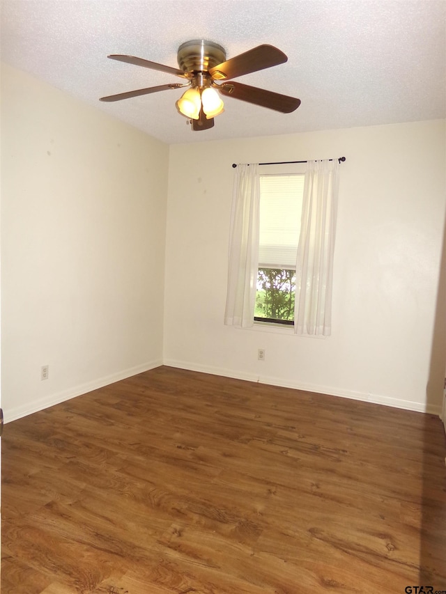 803 Corey, Whitehouse, TX 75791 - empty room with ceiling fan, wood finished floors, a textured ceiling, and baseboards