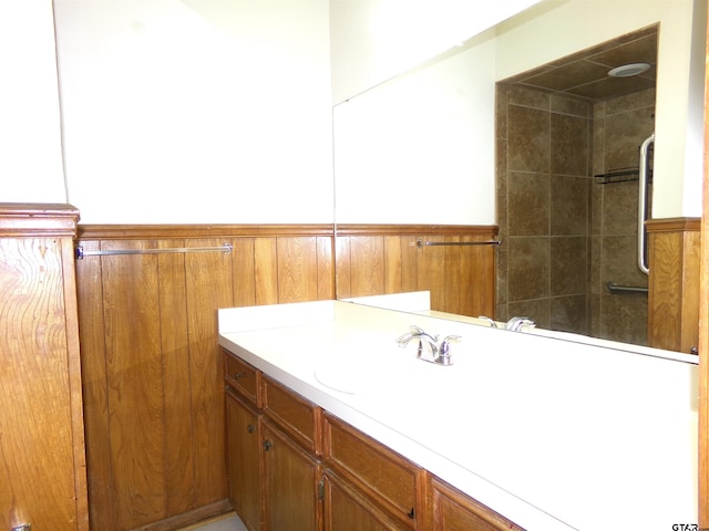 803 Corey, Whitehouse, TX 75791 - full bathroom featuring vanity, a shower, and a wainscoted wall