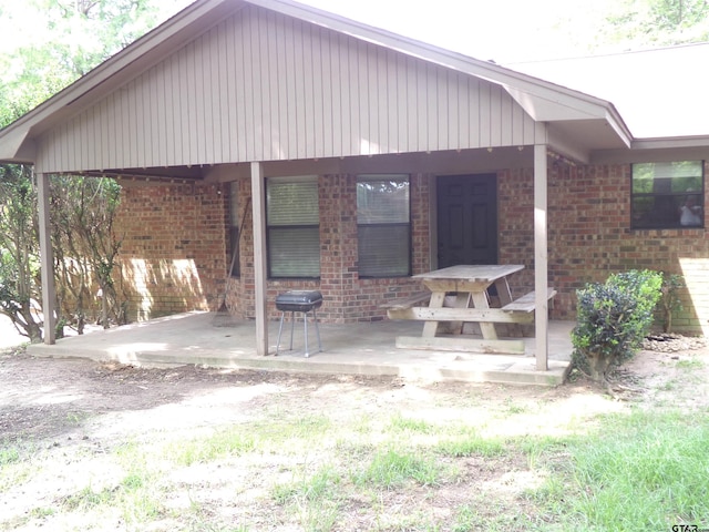 803 Corey, Whitehouse, TX 75791 - rear view of property featuring brick siding and a patio area