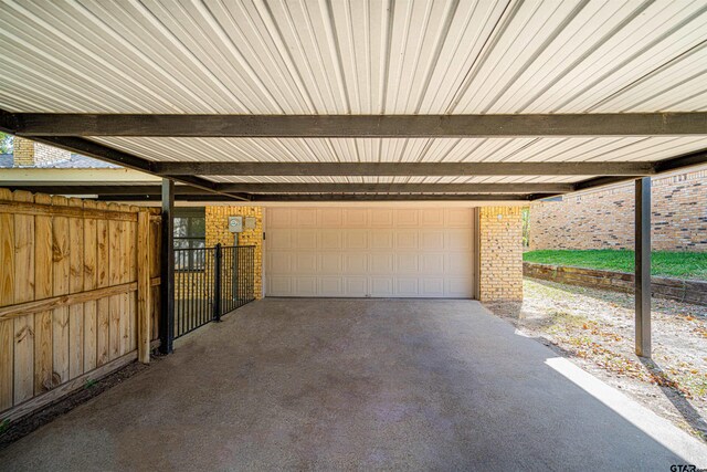 garage featuring a carport