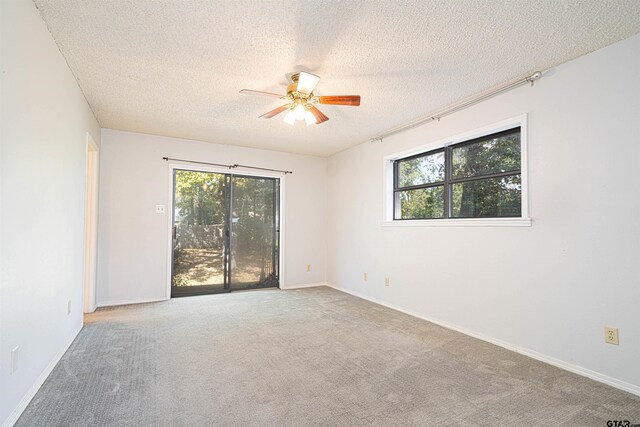 unfurnished room with carpet, a textured ceiling, and ceiling fan