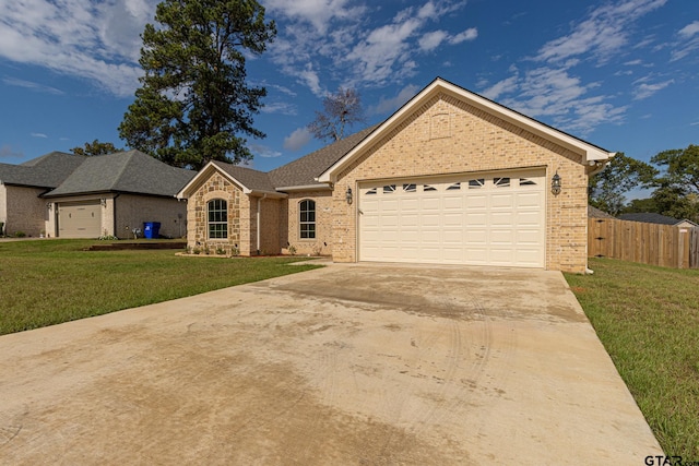 single story home with a garage and a front yard