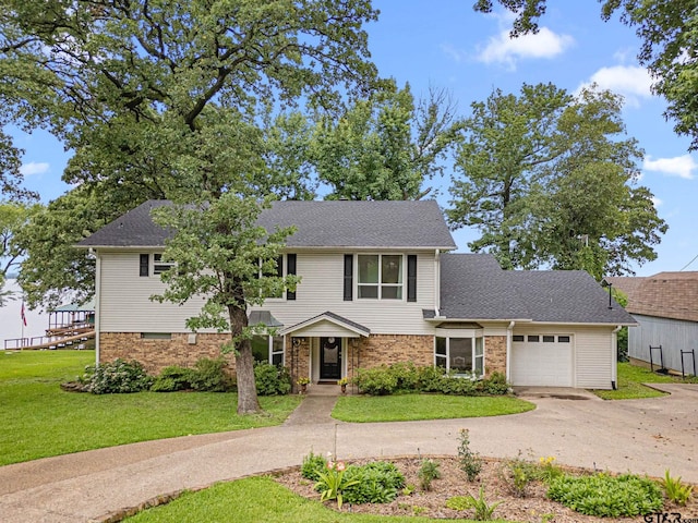 21028 Bay Shore Dr, Flint, TX 75762 - traditional home featuring an attached garage, a front yard, driveway, and a shingled roof