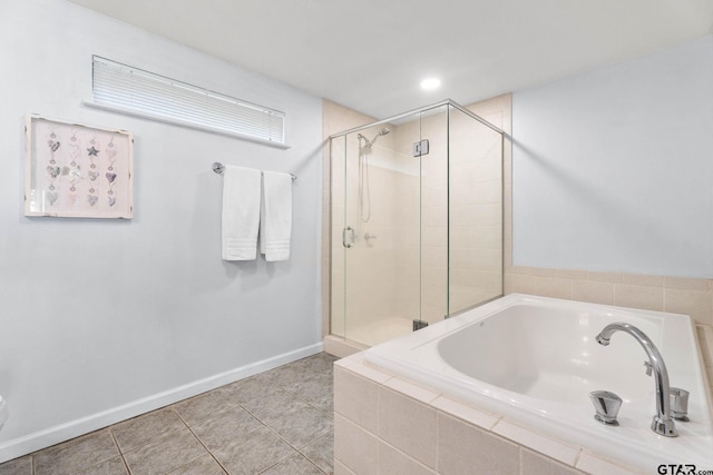 21028 Bay Shore Dr, Flint, TX 75762 - bathroom featuring a bath, a shower stall, and tile patterned flooring