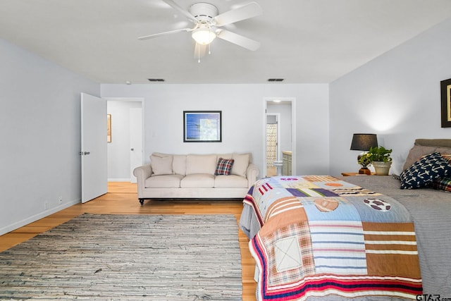 21028 Bay Shore Dr, Flint, TX 75762 - bedroom featuring wood finished floors, ensuite bathroom, and a ceiling fan