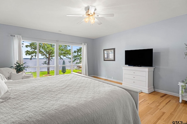 21028 Bay Shore Dr, Flint, TX 75762 - bedroom with light wood-type flooring and ceiling fan